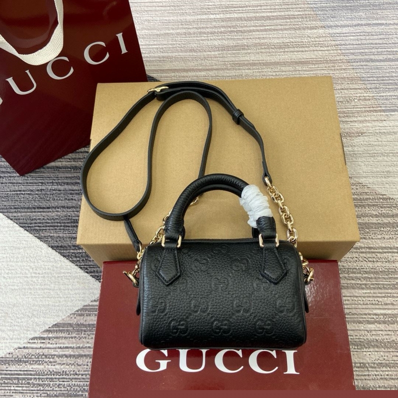 G*u*i top handle bags